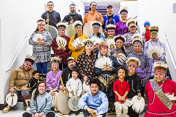 People dressed in traditional attire gather for a portrait at the 2018 Festival of Native Arts. UAF photo by JR Ancheta.
