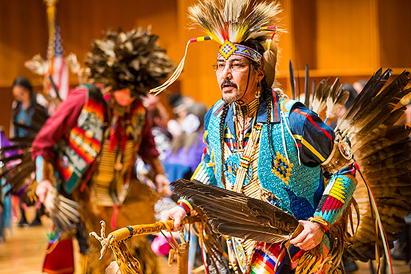 Dancers in colorful attire and feather regalia perform at the 2018 Festival of Native Arts. UAF photo by JR Ancheta.