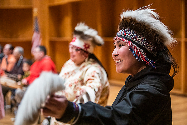 A woman wears a headdress and holds traditional dance fans while performing at the 2019 Festival of Native Arts. UAF photo by JR Ancheta.