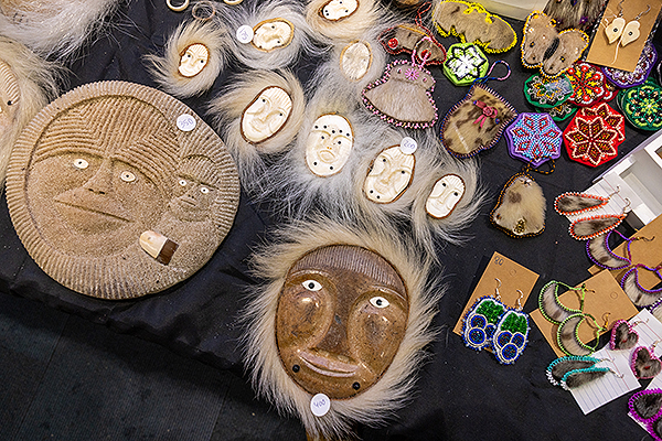 A collection of traditional masks and beadwork lies on display during day two of the 2024 Festival of Native Arts. UAF photo by Eric Engman.
