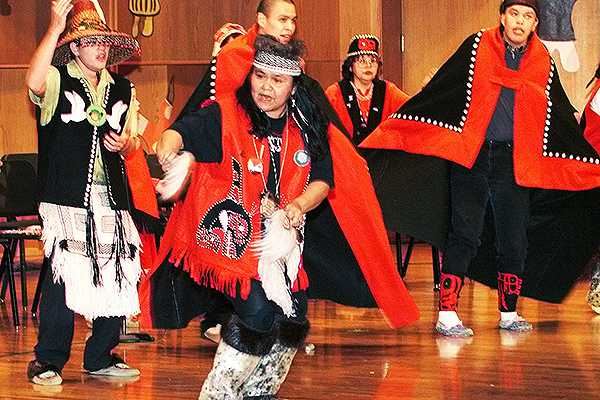 Janet Graham, of Metlakatla, dances with the dance group Naa Luudisk Gwaii Yatxi during the opening night performances of the 1999 Festival of Native Arts Thursday March 4, 1999, in the Davis Concert Hall. Twenty-five dance groups and at least 40 Native artisans were expected to participate in the 1999 festival, making it the largest to date. This years theme is Dancing Our Stories. Fairbanks Daily News-Miner photo by Sam Harrel.