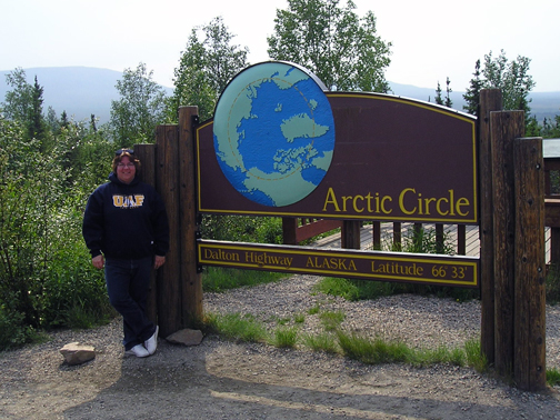 Anita poses at the Arctic Circle.