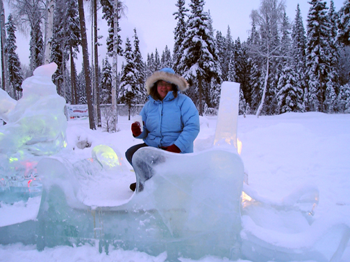Anita lounges on an ice sleigh.