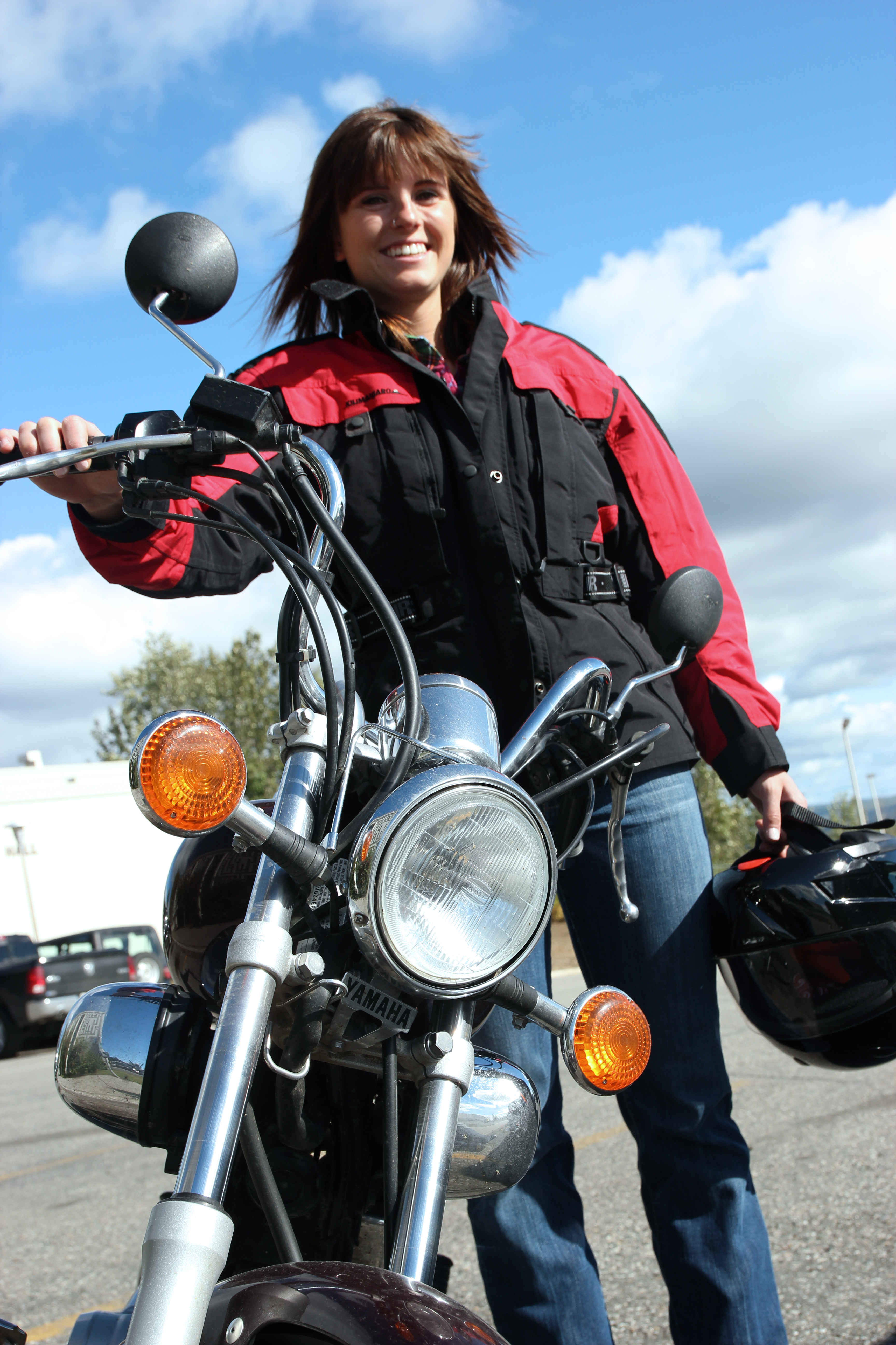 Julie poses with her Yamaha motorcycle.