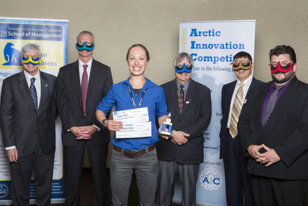 UAF Chancellor Dana Thomas, UA President Jim Johnsen, Shalane Frost, School of Management Dean Mark Herrmann, Professor Ping Lan, and Bill Staley of Northrim Bank pose with the 2nd place and Fan Favorite awards at the 2016 Arctic Innovation Competition.