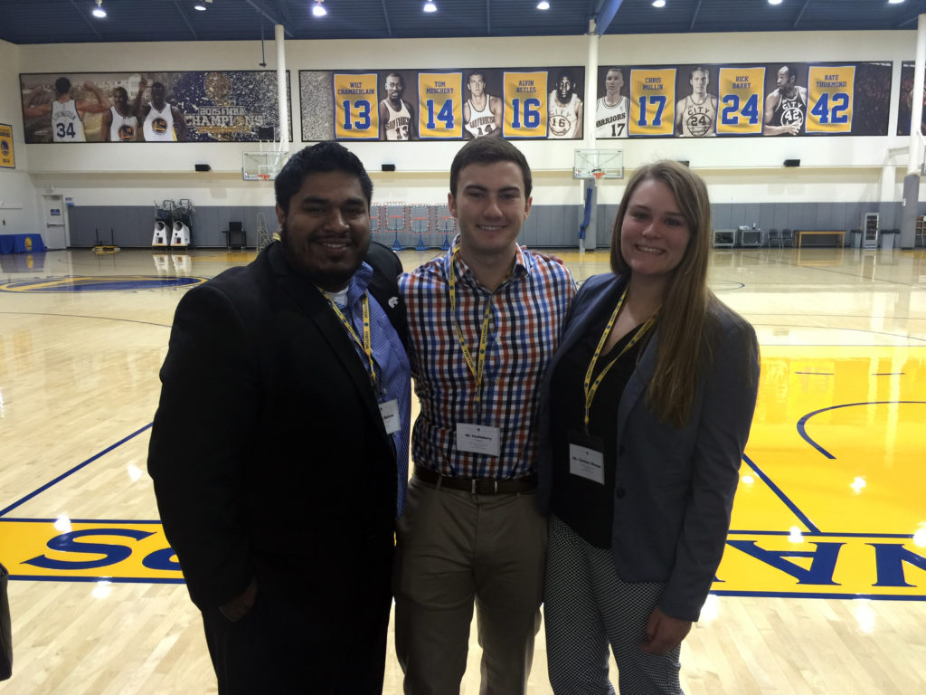 Henry Bolanos, Huckleberry Hopper, and Claressa Ullmayer in the gym at the Oracle Arena, home of the Golden State Warriors basketball team