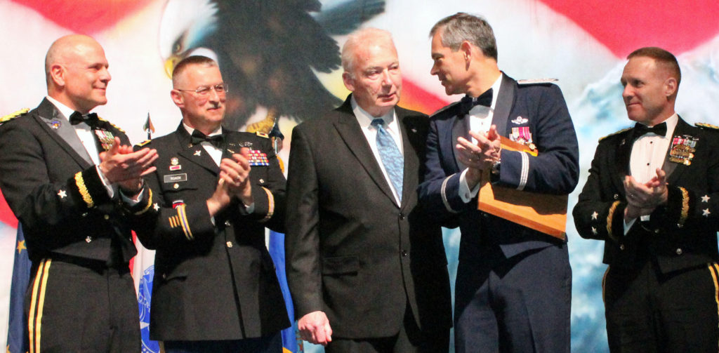 J3W5W3 Army and Air Force key leaders show their appreciation for Jim Dodson, the Fairbanks Economic and Development Corporation President and CEO, April 28, 2017 at the 49th Annual Military Appreciation Banquet at the Carlson Center in Fairbanks. The leaders presented Dodson with the Messer Award at the event to honor his efforts to improve community-military relations and service on the Save Eielson Committee during the Base Realignment and Closure Commission testimonies in 2005. (Photo by Mary M. Rall/U.S. Army Alaska Public Affairs)