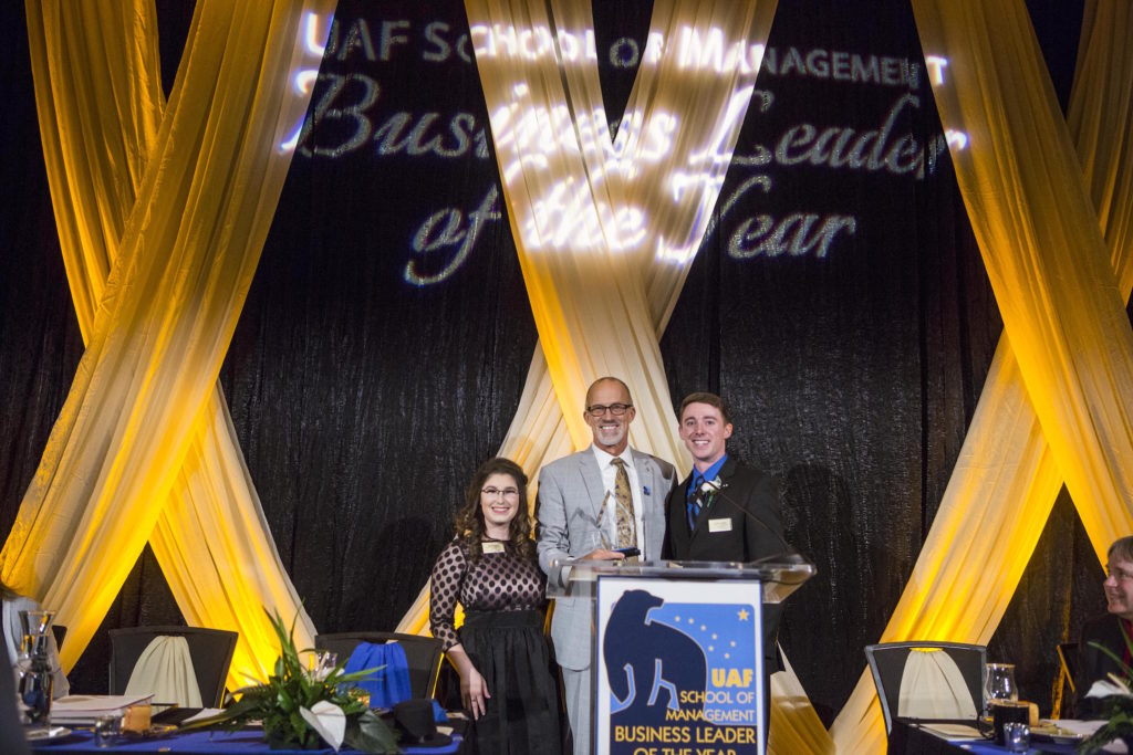 Steve accepted his award from student committee co-chairs, Claire Everts and Zack Morris. UAF Photo by JR Ancheta.