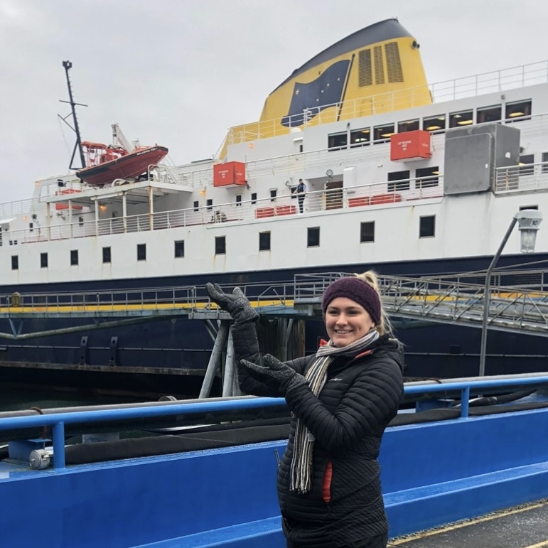 Cassidy Patton pointing to ship