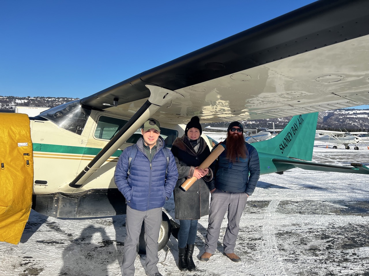 Anthony stands with Dr. Elena Suleimani and Dr. Barrett Salisbury for a tsunami mapping project.