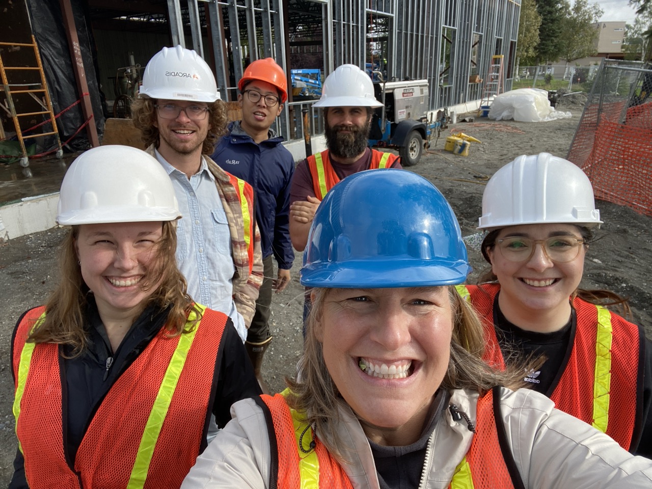 Tracy takes a selfie with her team members on site at the FNSB Noel Wien Library renovation and addition.