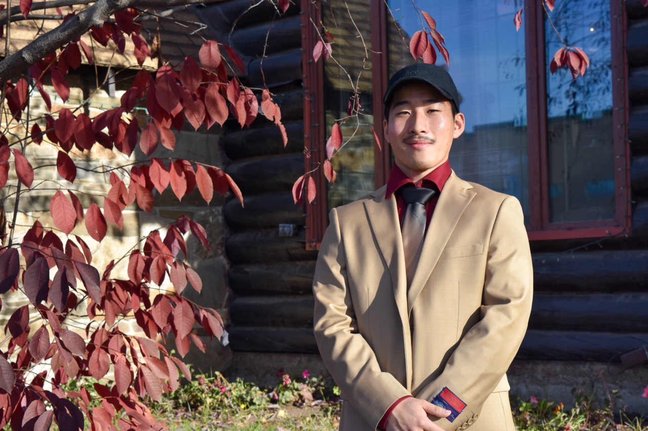 Student, Shang Wei, poses in his new attire from Frank’s Menswear.