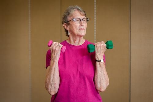 Woman holding barbell weights