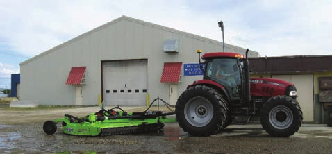 A parked tractor in front of a building