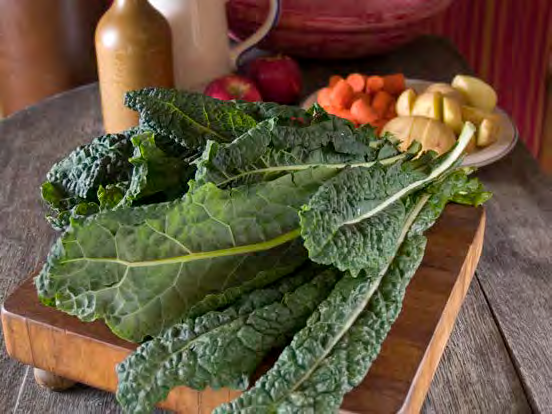 Long thin ruffled greens on a cutting board