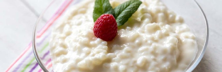 Pudding garnished with berries in a bowl