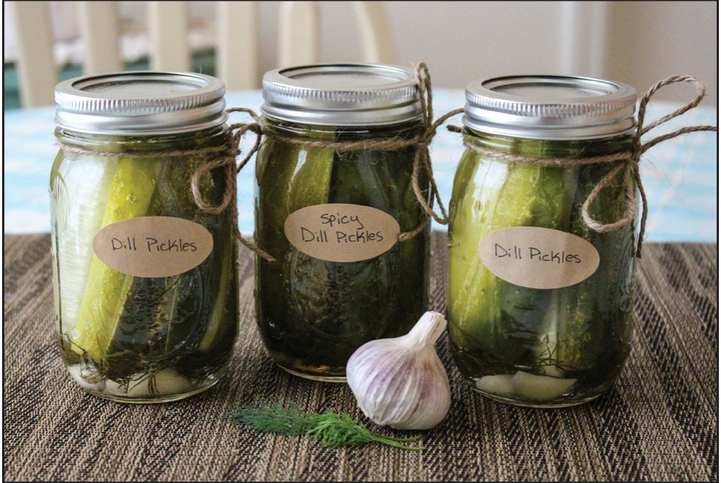 Three sealed jars next to garlic