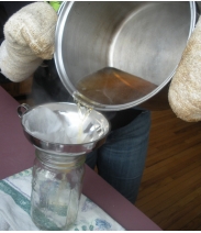 Pouring sap into a pot.