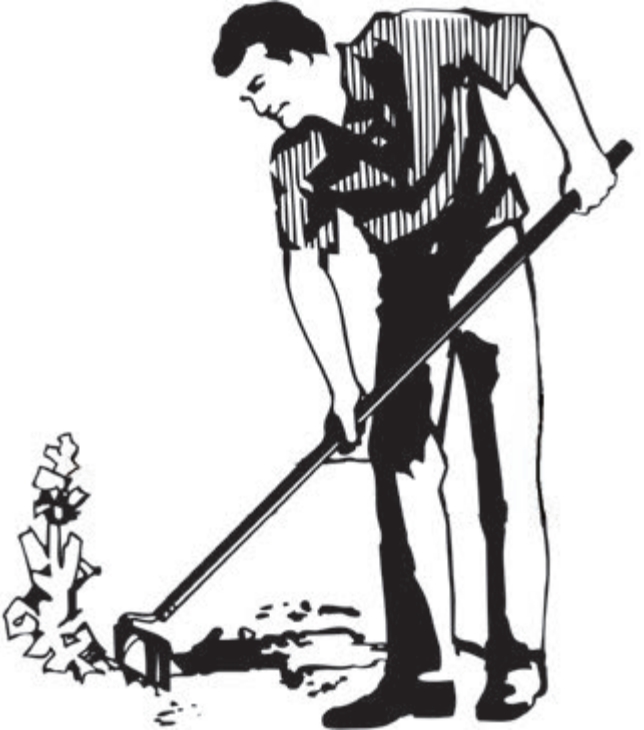 Man digging at the ground with a tool