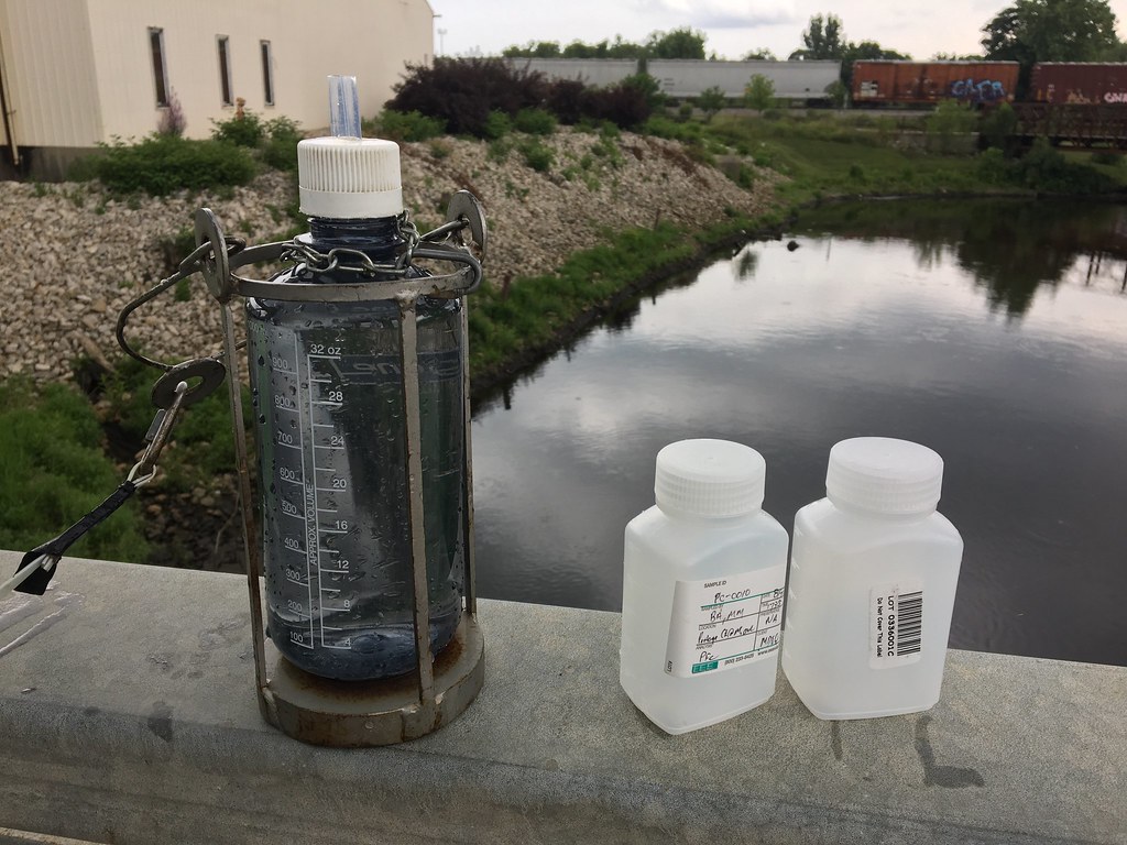 Two water samples to be tested for PFAS are taken from Portage Creek, in the Kalamazoo River watershed.