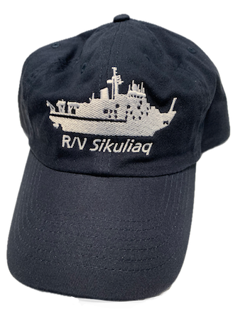 Sikuliaq baseball cap Photo of a navy blue baseball cap with an image of the research vessell sikuliaq on the front