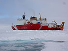 Ship in the ice capped ocean