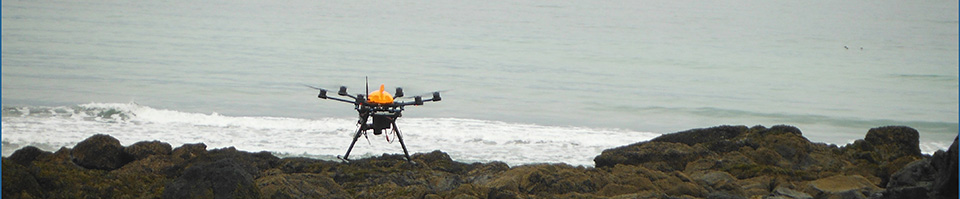 Unmanned aircraft flying over a beach