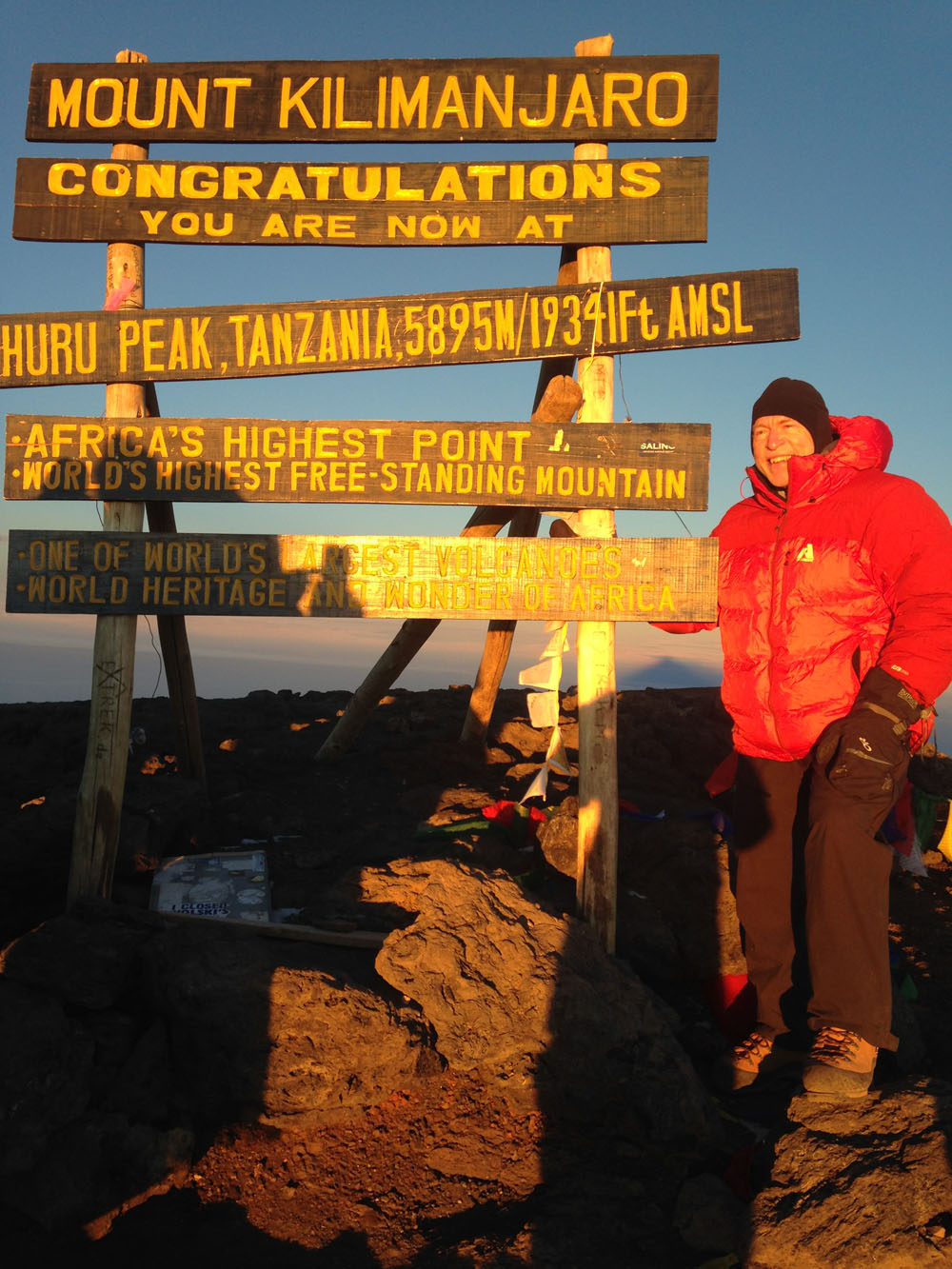 John Keller summitting Mt. Kilimanjaro