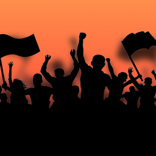 Silhouette of people protesting on an orange background