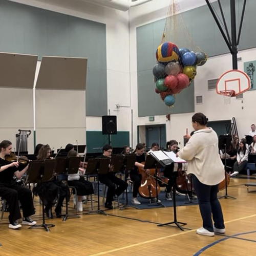 UAF music student Ariana Lopez leads the beginning orchestra at Randy Smith Middle School. UAF Photo