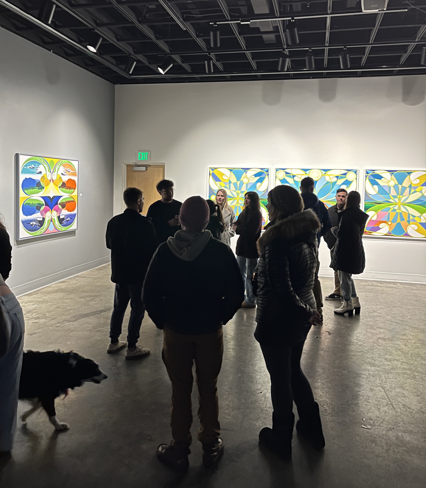 A crowd gathering in the UAF Art Gallery for the opening of Kyle Agustines' BFA Thesis exhibition, "The Sway of Surroundings." UAF Photo by Abby Druckenmiller.