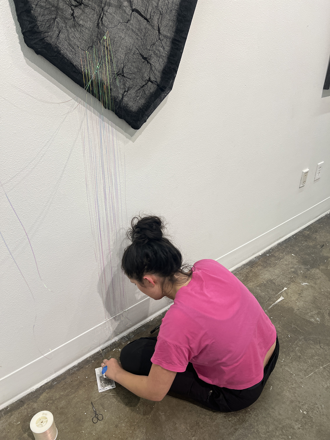 Ayona-Reily Dixon works with threads on a piece of artwork in the UAF Art Gallery. Photos courtesy of Bitzer & Dixon.