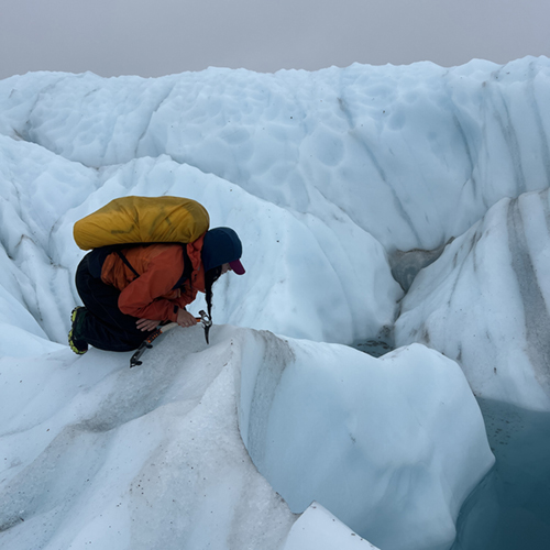 Ayona-Reily Dixon on a glacier gathering materials and inspiration for the Cognitive Cryogenics exhibition with Sasha Bitzer. Photo courtesy of Sasha Bitzer