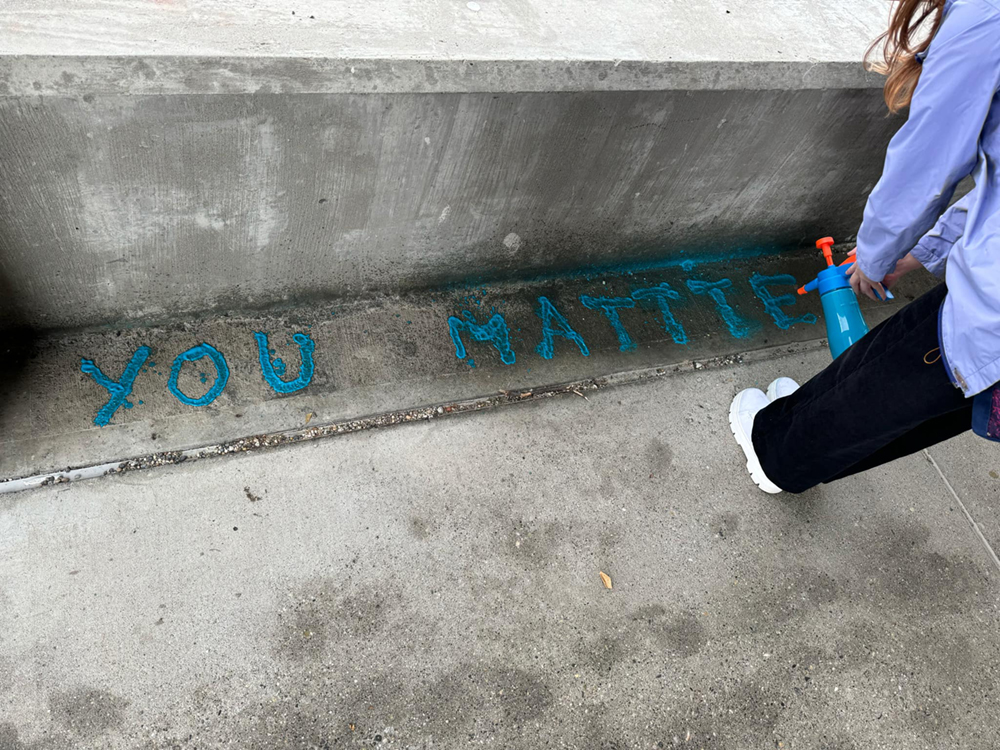 "You Matter" stenciled on the concrete walkway on the UAF campus. UAF Photo by Jamie Haman