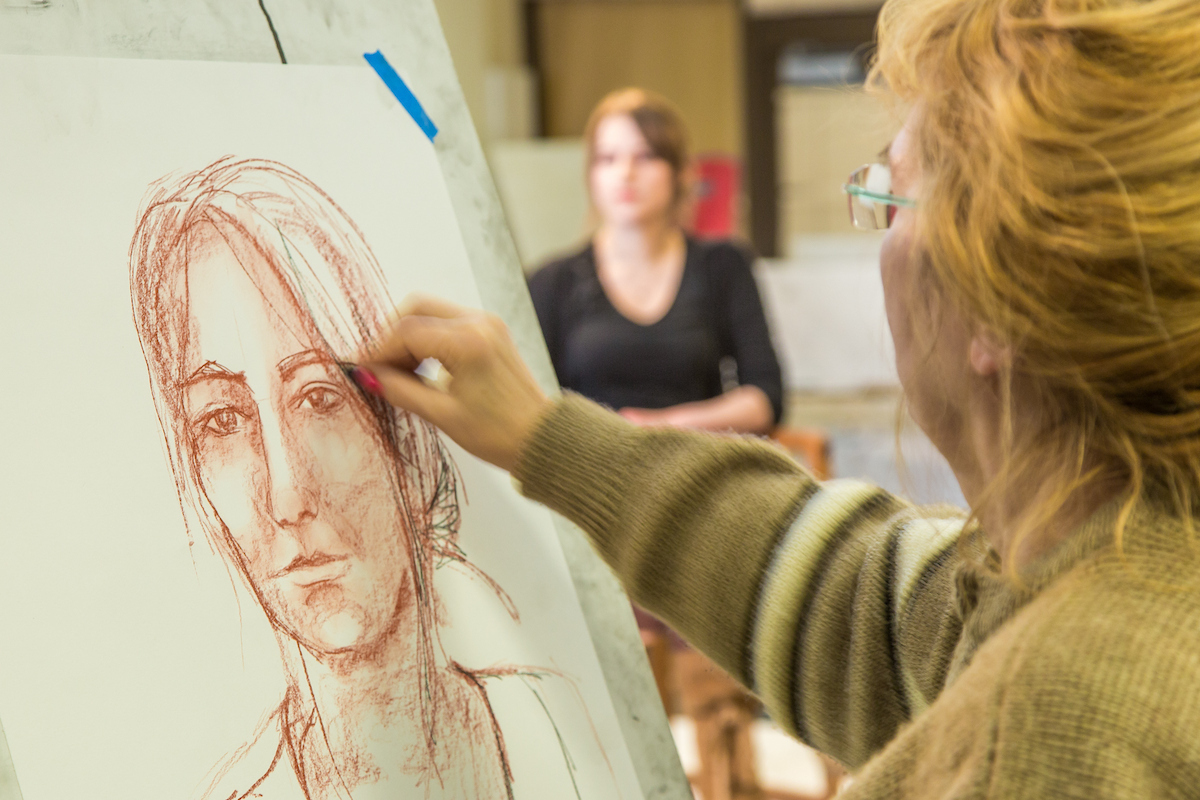 Hana Esop sketches the subject during the portrait painting class in the UAF Fine Arts complex, offered during Wintermester 2014. UAF Photo by Todd Paris