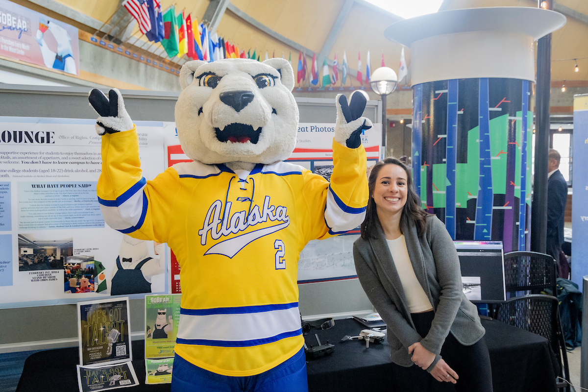 Students, staff and faculty pack the Lower Wood Center Lounge for 2024 RCA Day, an event that showcases ungrad research students who received URSA grant funding to pursue a project of their choice. UAF Photo by Leif Van Cise.