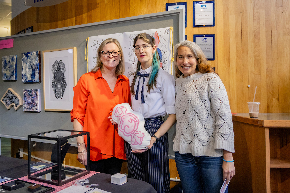 URSA RCA Day 2024 CLA Honorable Mention Marina Gonzalez Mazo poses with Dean Ellen Lopez and Associate Dean Carrie Baker. UAF photo by Leif Van Cise