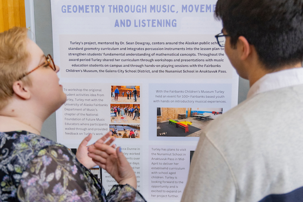 Beatrice Turley presents their RCA Day poster on Understanding Introductory Geometry Through Music, Movement, and Listening. UAF Photo by Leif Van Cise.