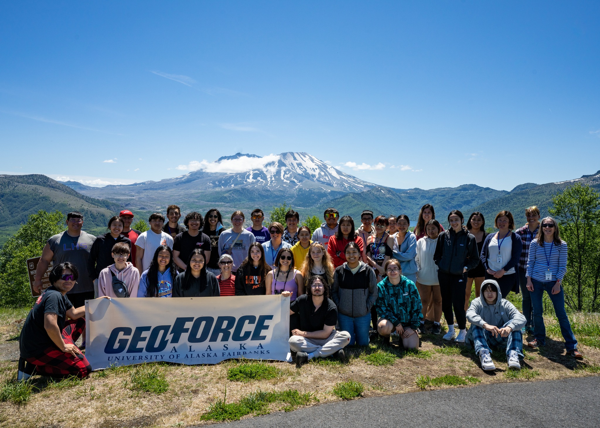 students posing holding a banner that reads GeoFORCE Alaska