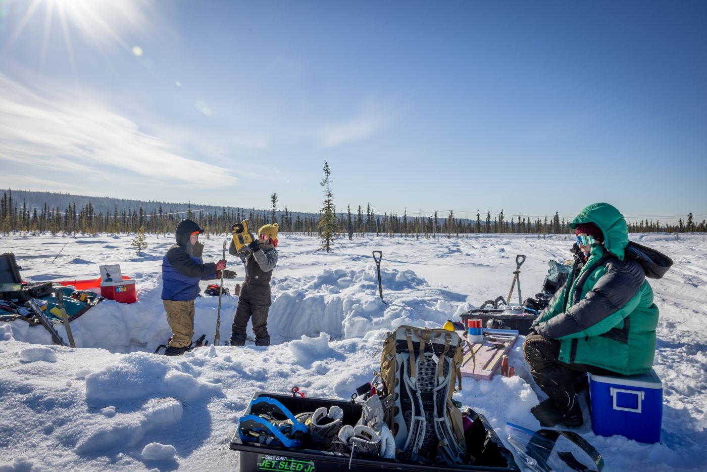 From left, Louise Farquharson of the University of Alaska Fairbanks Geophysical Institute, and Shannon Hibbard and Jennifer Kielhofer, both of the Desert Research Institute, work at one of their permafrost coring sites in the Goldstream Creek area of Fairbanks on March 23, 2026