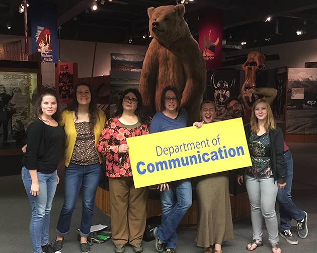 Communication Graduates and Adjuncts pose with Dr. Taylor at the UA Museum of the North.