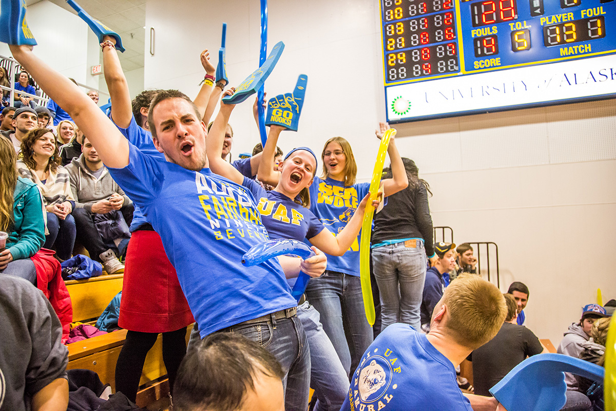Spectators in the student section react to another bucket during a 2013 Nanooks game against the UAA Seawolves in the Patty Gym. UAF photo by Todd Paris.