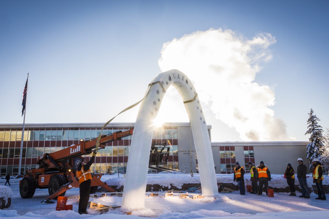 A team of students from the UAF student chapters of the Associated General Contractors and the American Society of Civil Engineers raise the 2018 ice arch in Cornerstone Plaza.