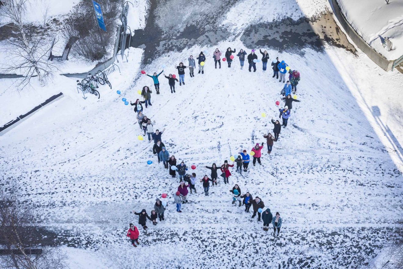 Students, staff and faculty, together with members of the Autism Society of Alaska, braved the cold to form a human ribbon Tuesday, April 3, 2018, to kick off Autism Awareness Month at Constitution Park on the Fairbanks campus.