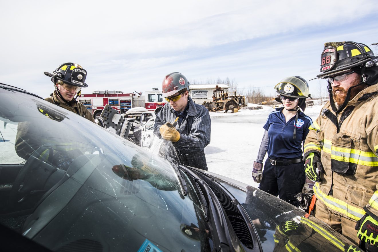 Paramedicine students with the Community and Technical College practice a vehicle extraction April 11, 2018, at the Fairbanks Solid Waste Facility.