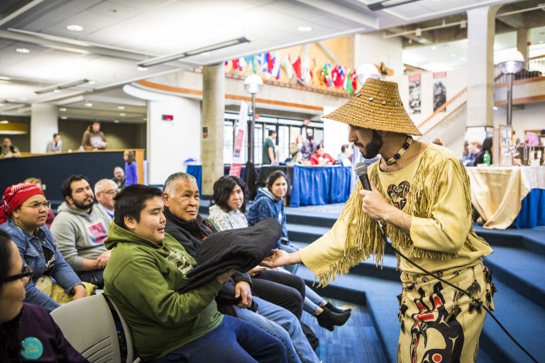 Wáats’asdiyeí Apayuk (Joe Yates), a UAF theatre and film student, shares a traditional Haida war canoe story during the 2018 Indigenous Peoples Day's Alaska Native storytelling event at the Wood Center multilevel lounge on Monday, Oct 8.