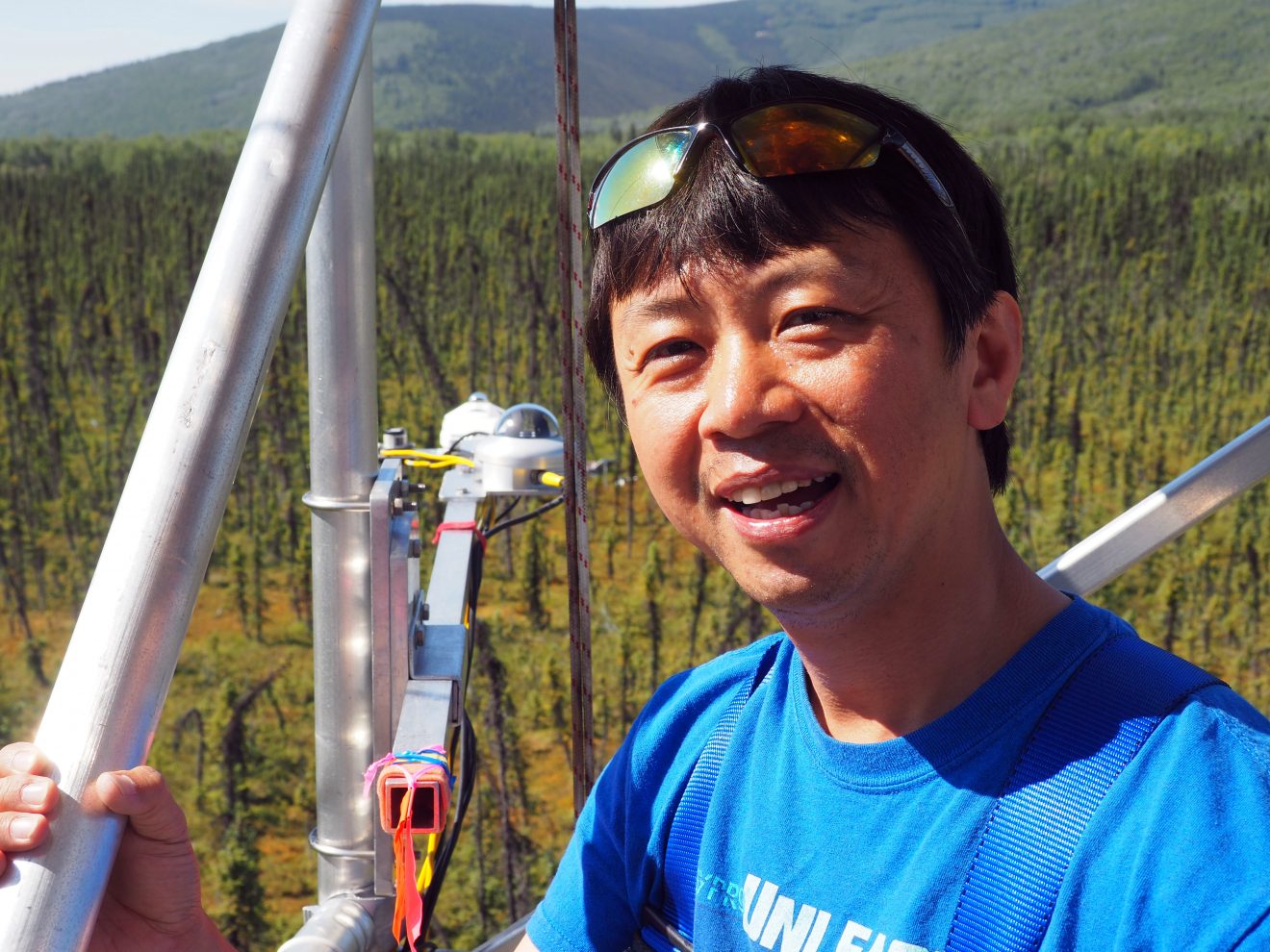 Heather McFarland photoHideki Kobayashi gathers information at Poker Flat Research Range to validate satellite data. Instruments from a 17-meter tower measure the carbon absorbed by the black spruce forest there.