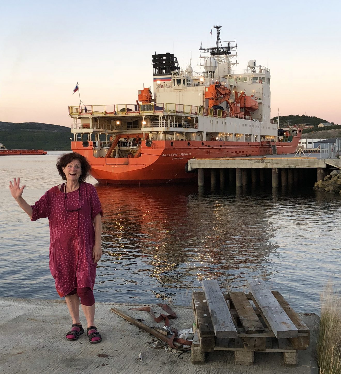 Photo courtesy of Moira O'MalleyFairbanks teacher Moira O'Malley poses in front of the Arctic research ship Akademik Tryoshnikov, which she will live on for the next 55 days.