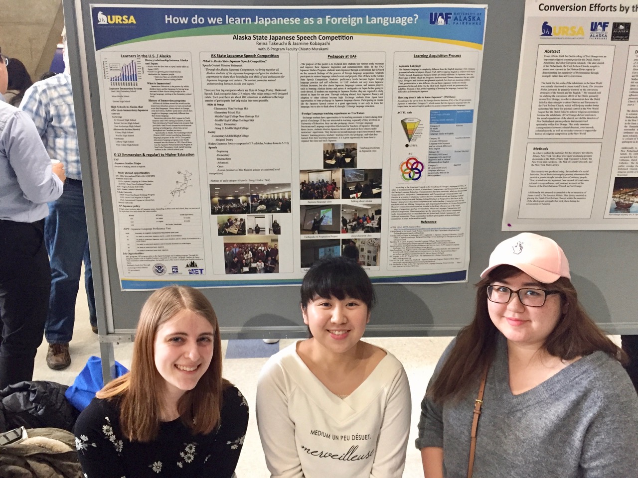 URSA students Bethany Paju, Reina Takeuchi and Eileen Ward in front of their Japanese language studies poster.