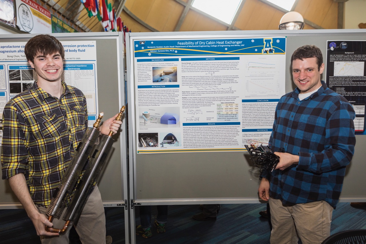 Benjamin Goebel and Austin Head display parts from their project at Research and Creative Activity Day 2018.